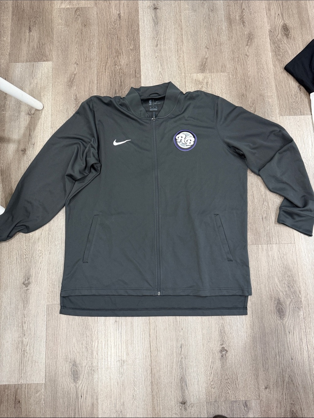 Nike Black Full-Zip Jacket with White Swoosh and Purple Logo